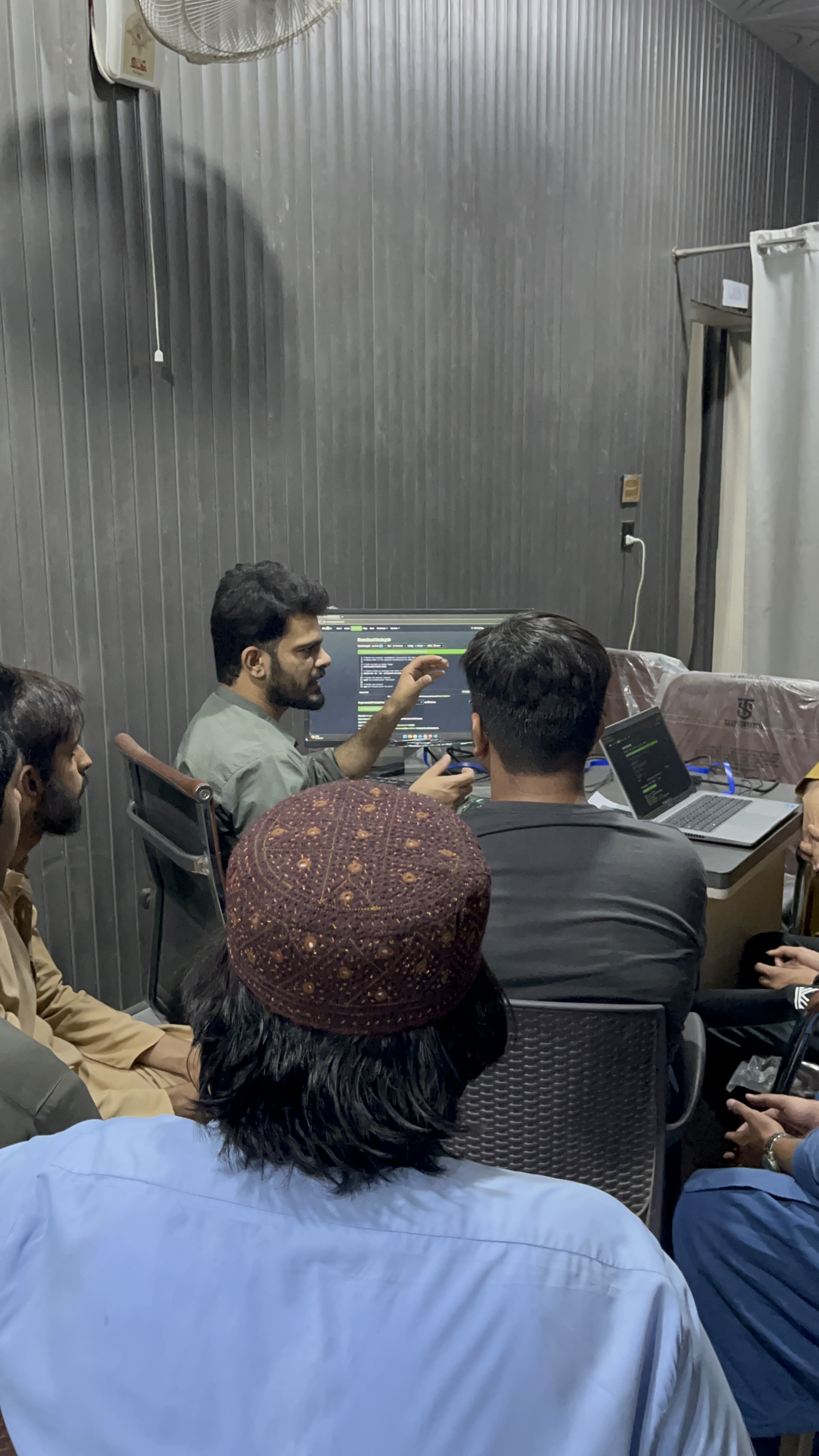 Instructor teaching coding at I.T Track